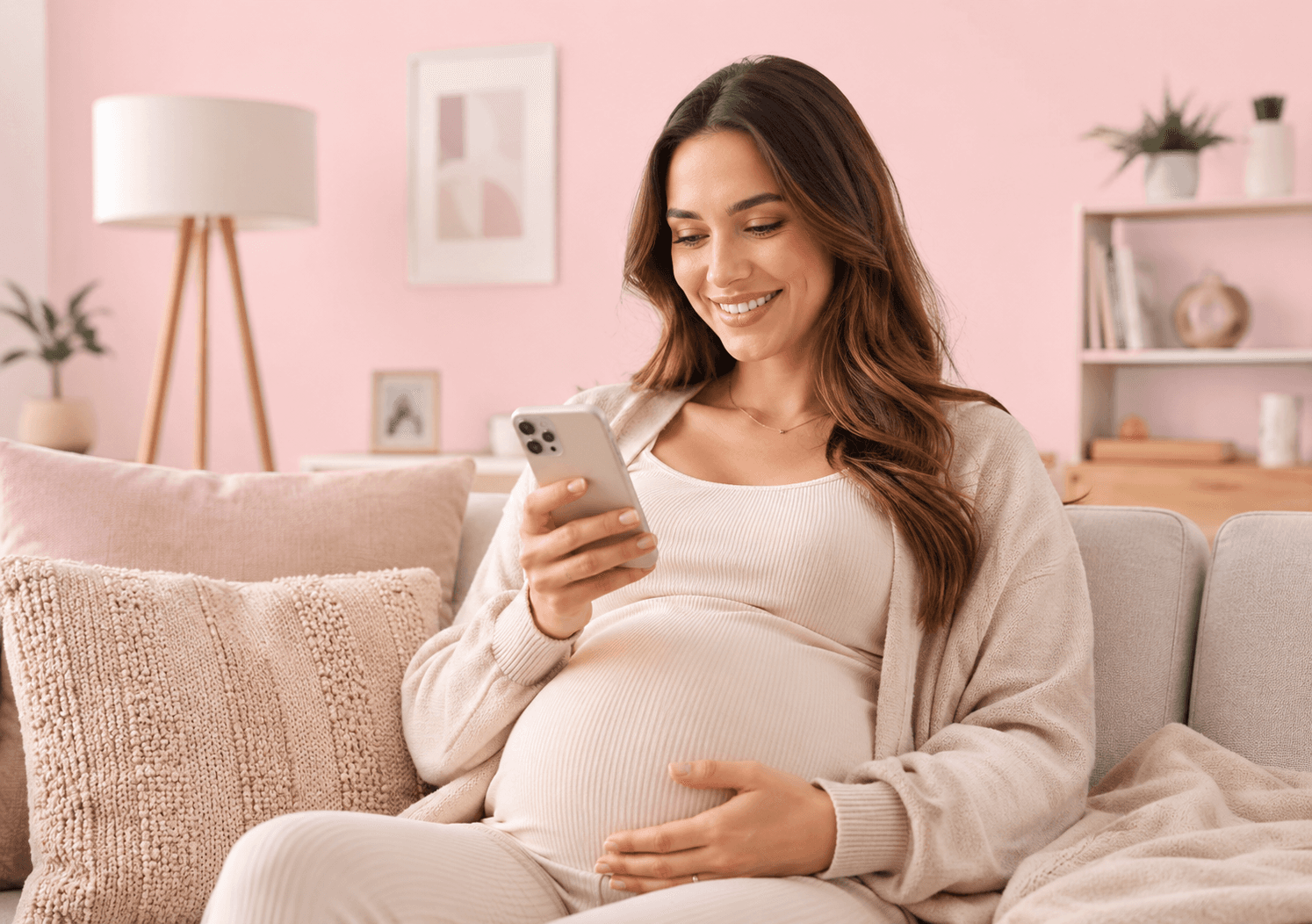 A pregnant woman using a smartphone at home